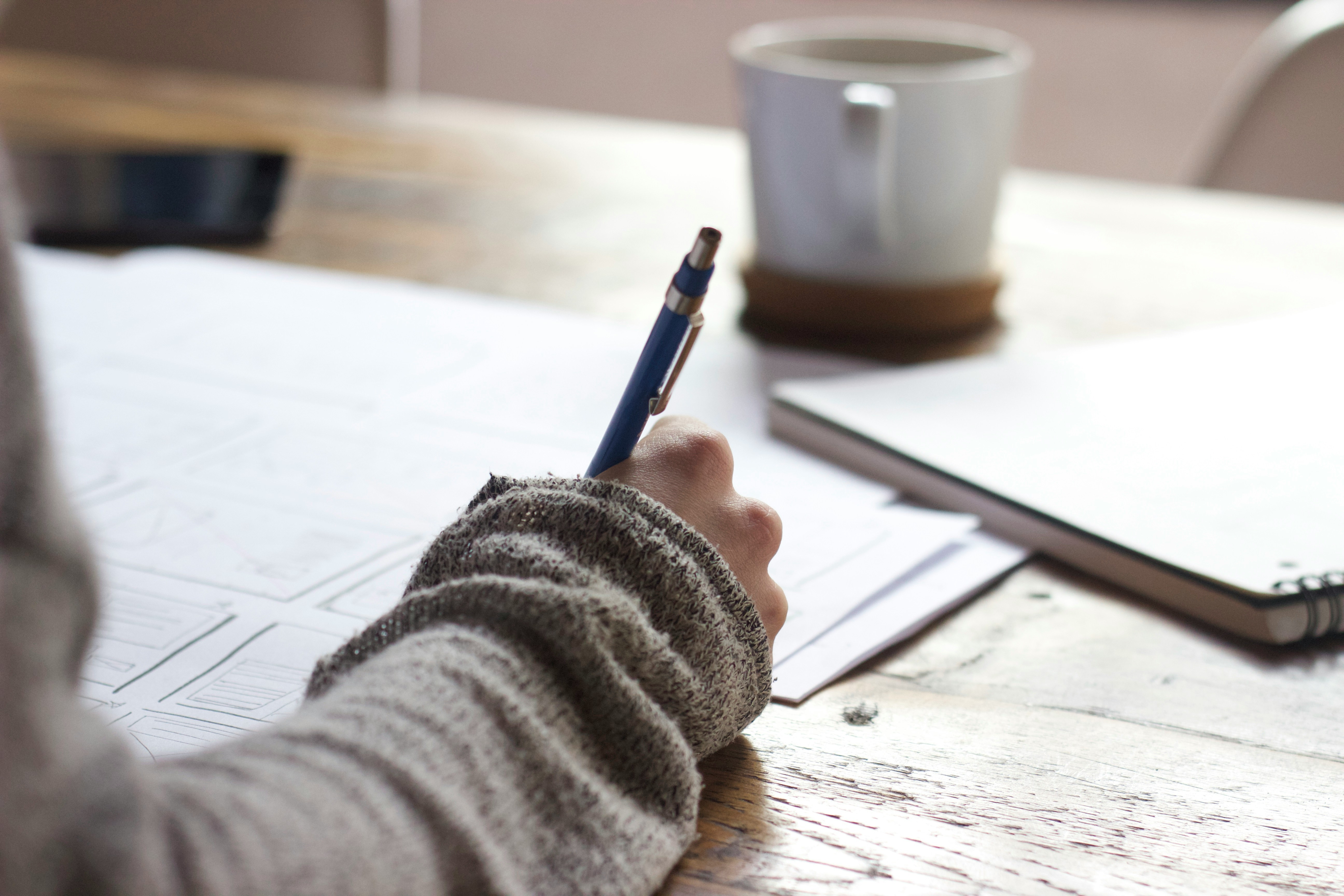 person writing and working