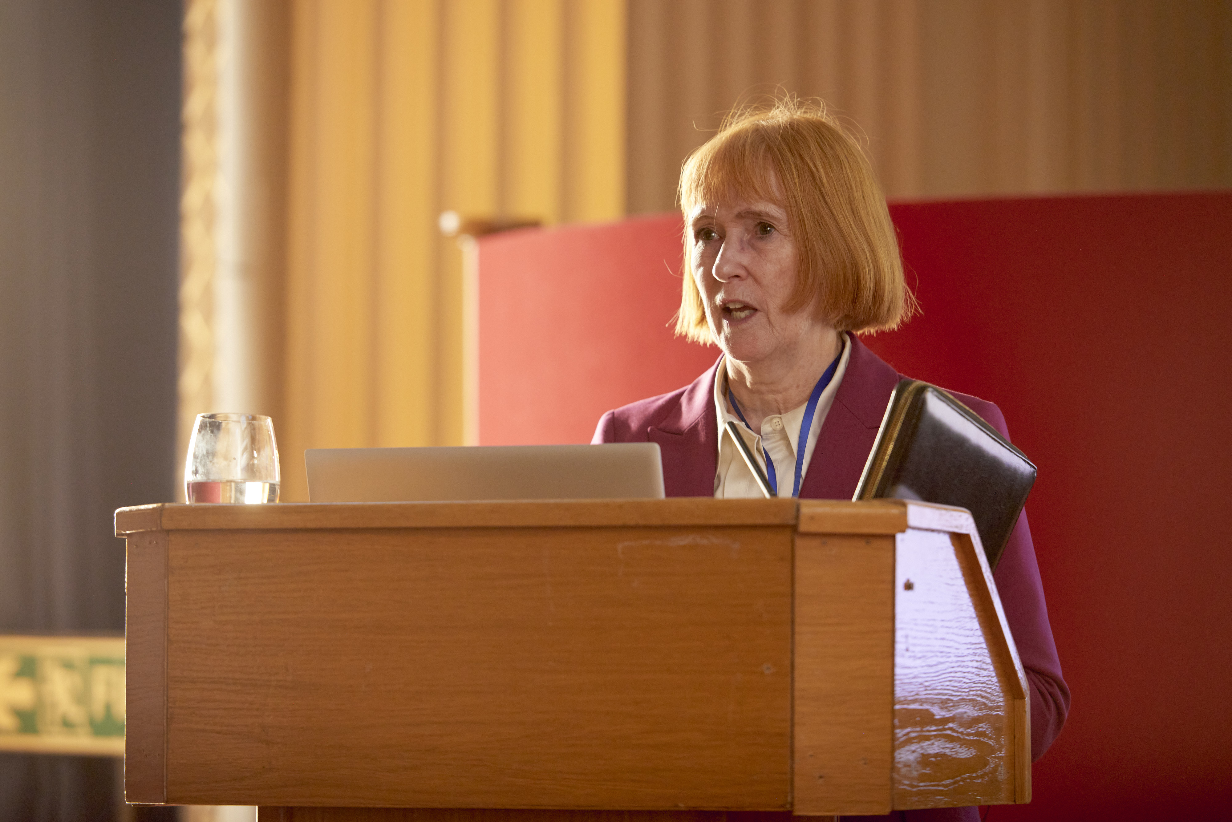 Til Wykes speaking at lectern