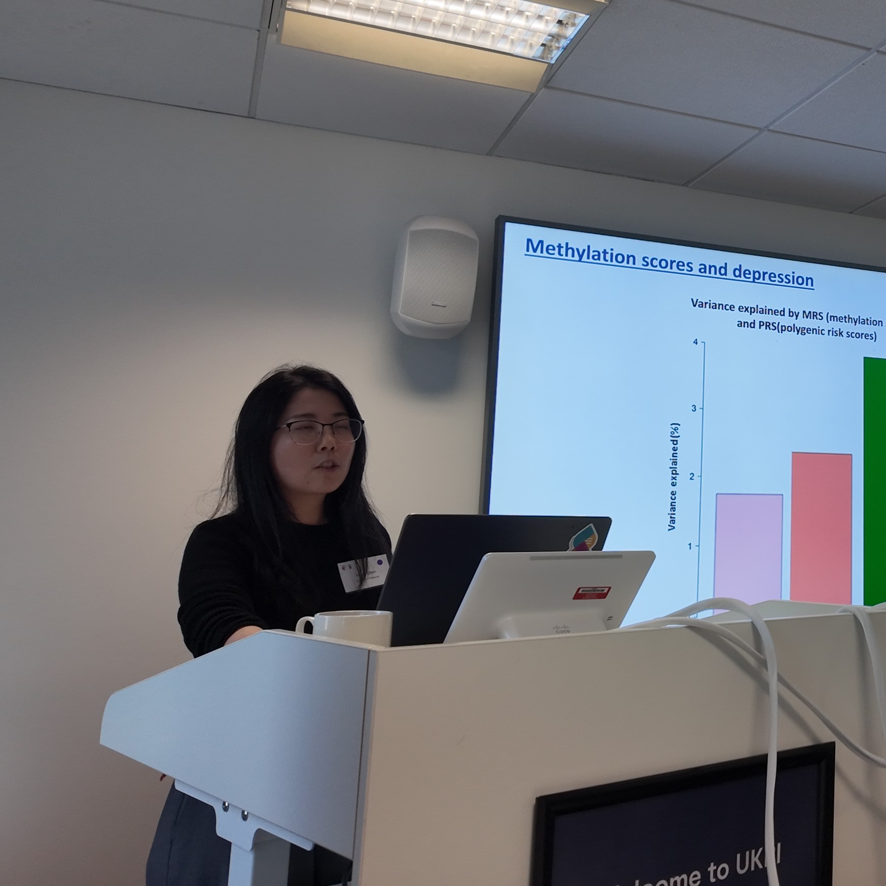 researcher presenting at podium