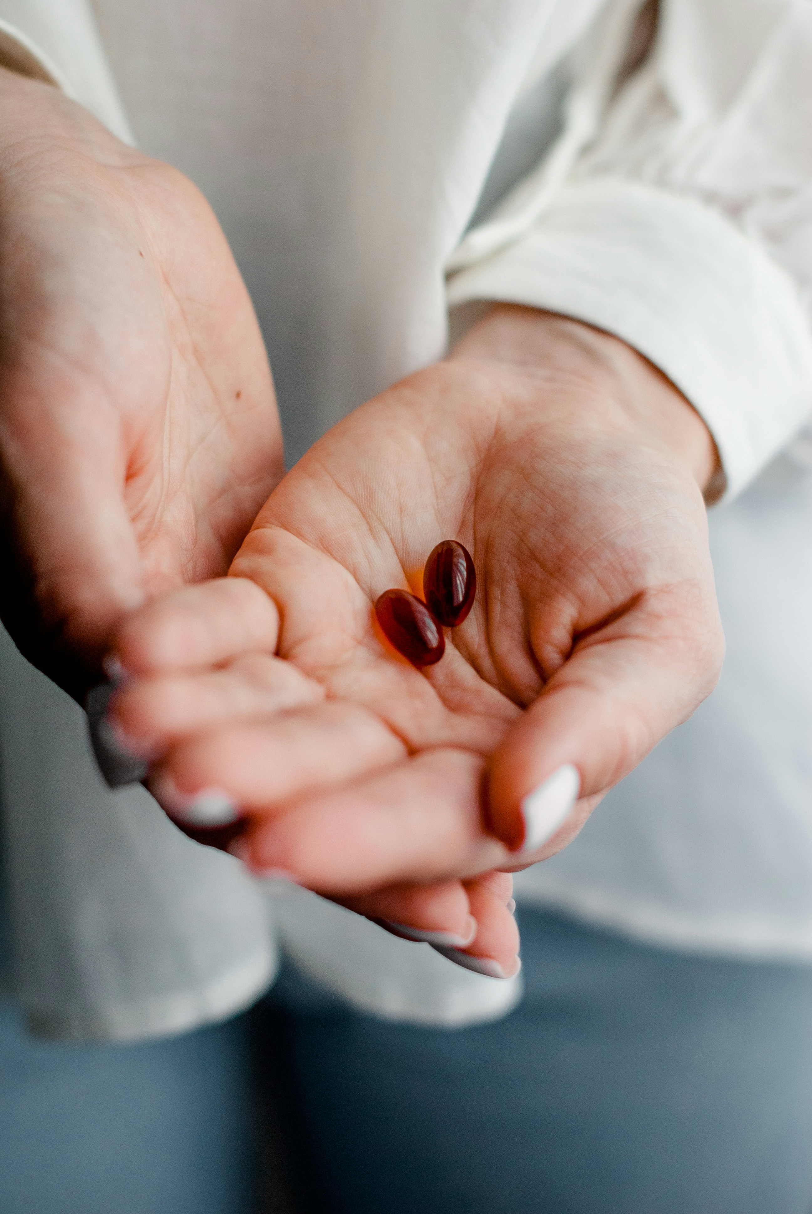 hands holding pills